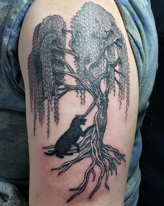 Tattoo a willow wood nymph petting a black lab by tattoo artist Britney Farmer of Sacred Mandala Studio.